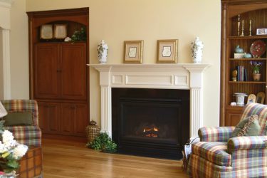 white decorative fireplace surround